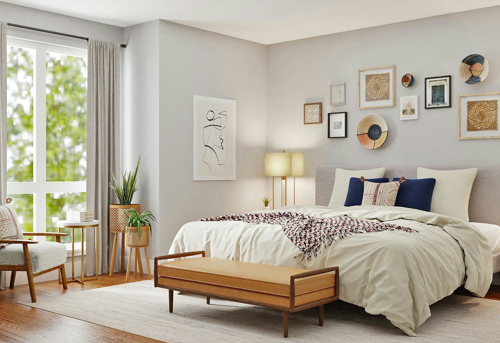 A bed against a wall arranged for pictures.